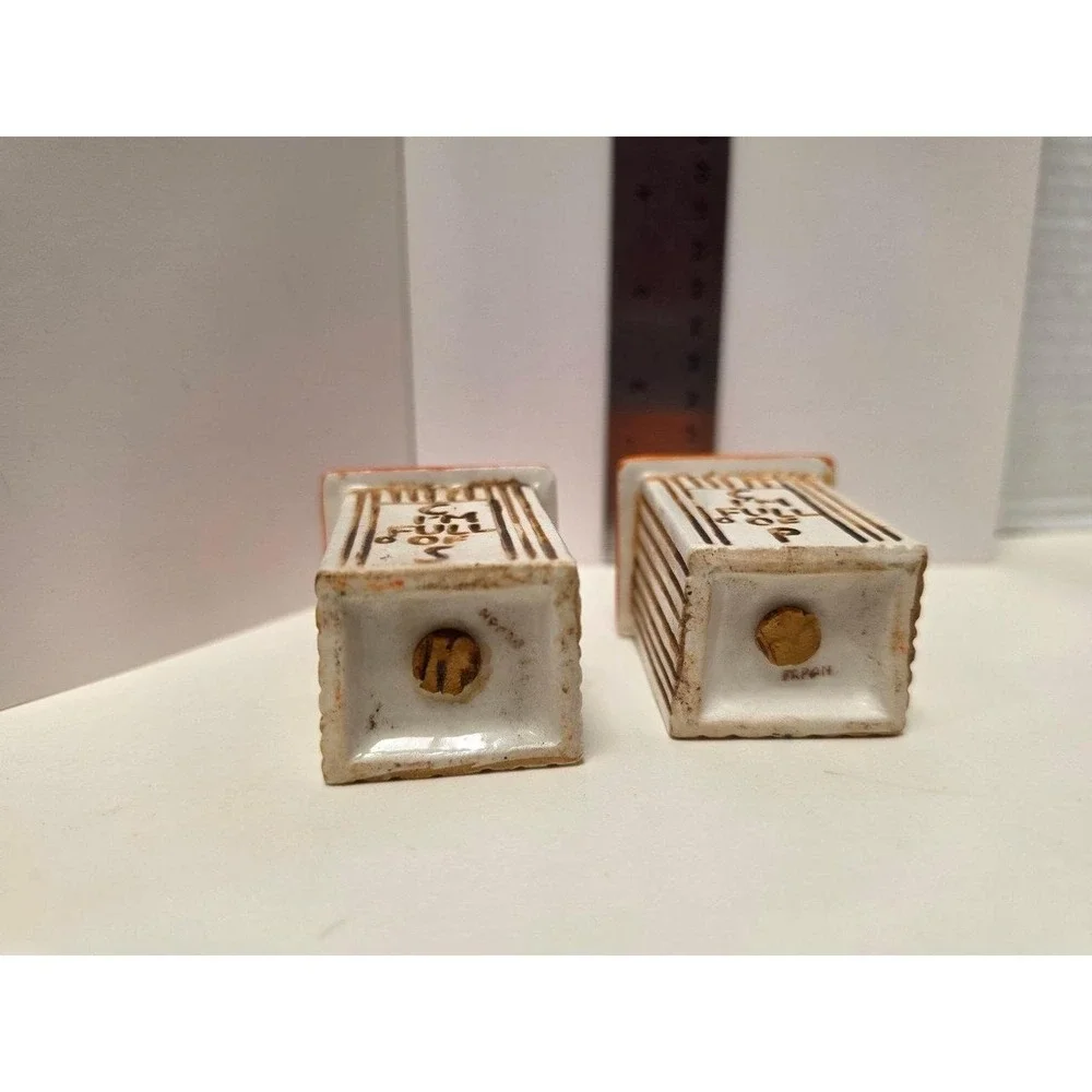 vintage, comical salt and pepper shakers feature an outhouse design with humorou